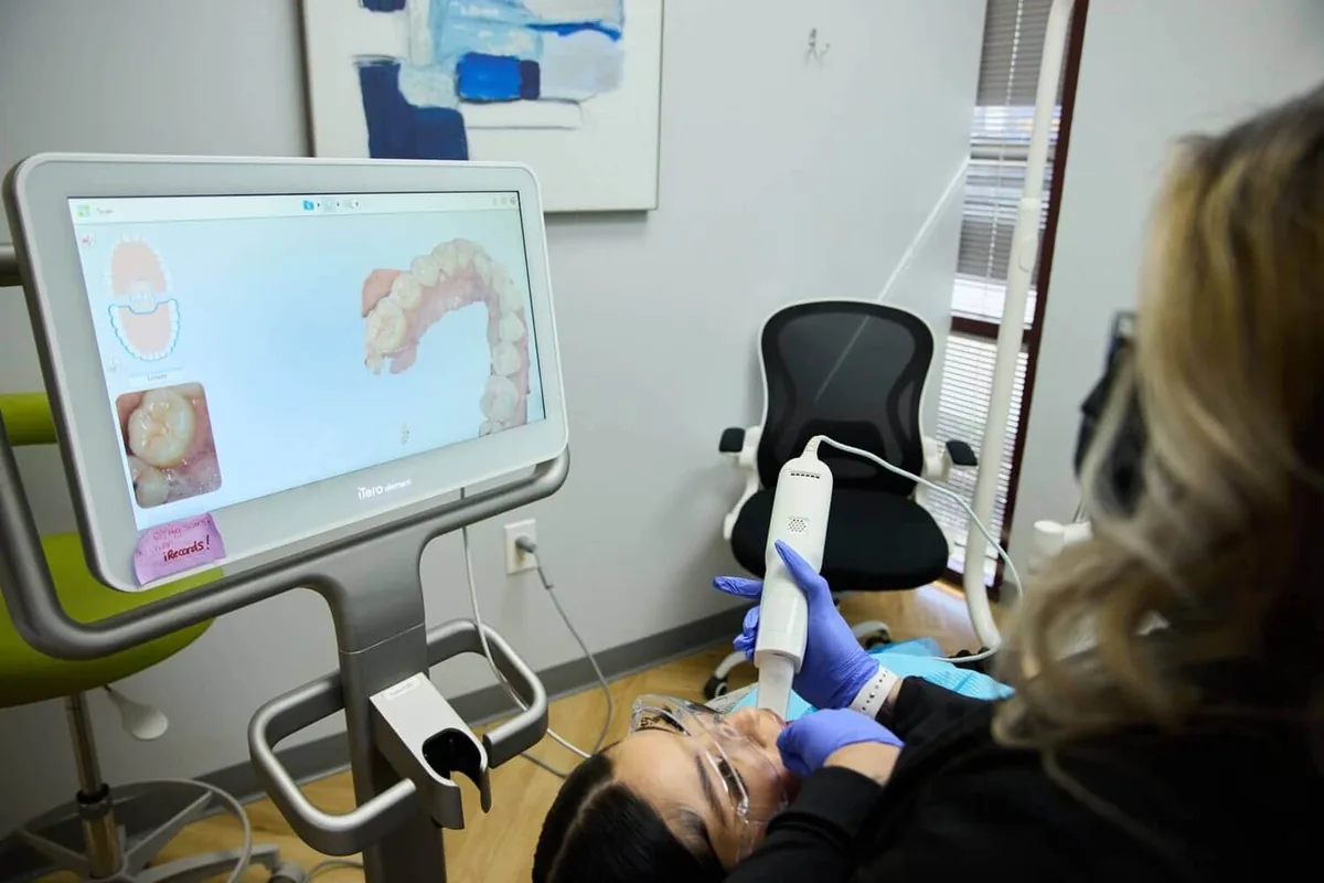 A person lying down and a monitor